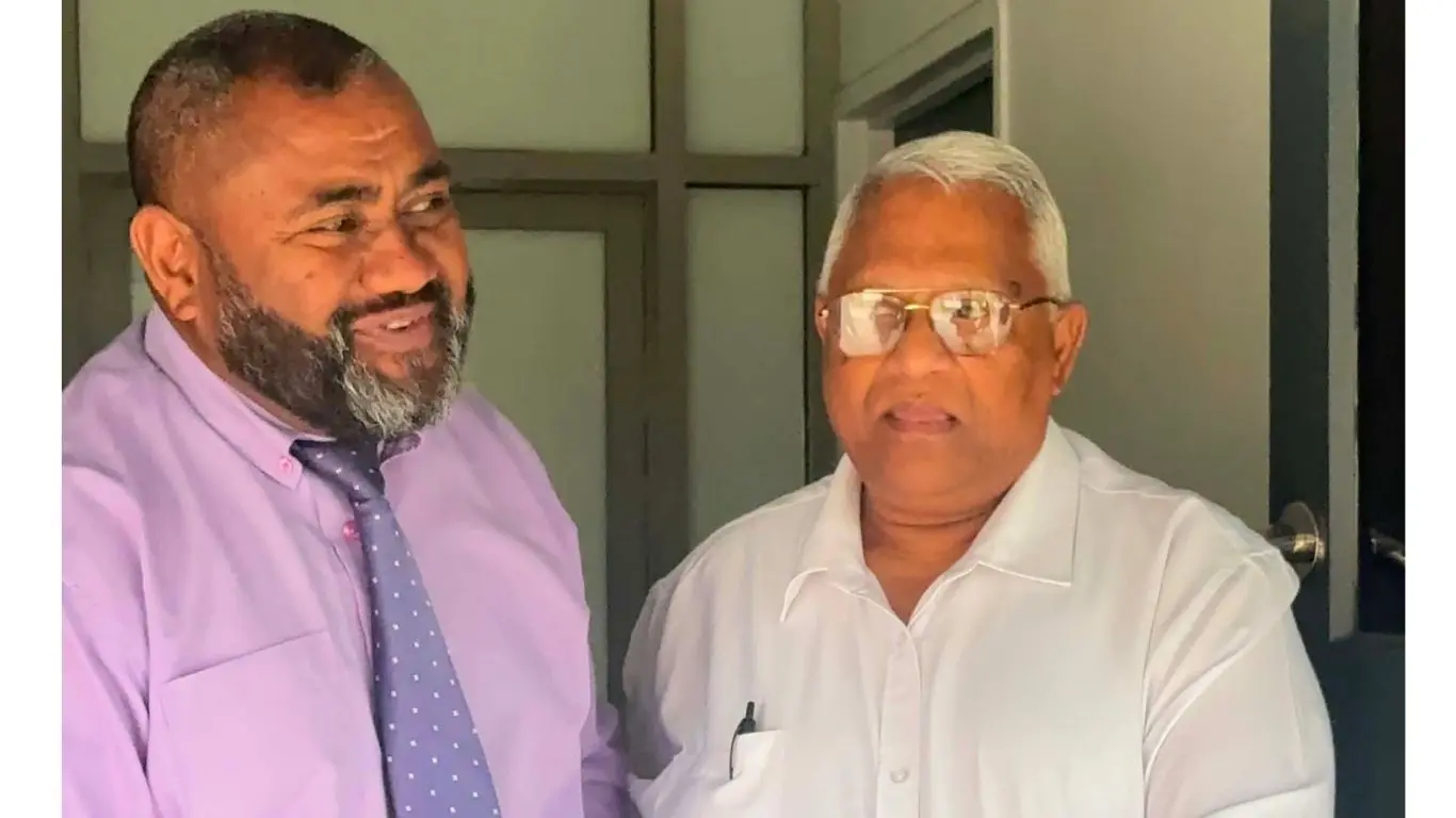 From left: Suspended Deputy Director of Strategic Planning, George Lagi and Defence witness, Divindra Bhagat outside the Suva Magistrate Court on August 19, 2026.