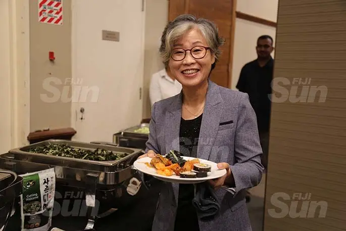 Korean Ambassador to Fiji Shin-hee CHO dishes a plate of Korean dishes at the Grand Pacific Hotel in Suva on August 26, 2020.