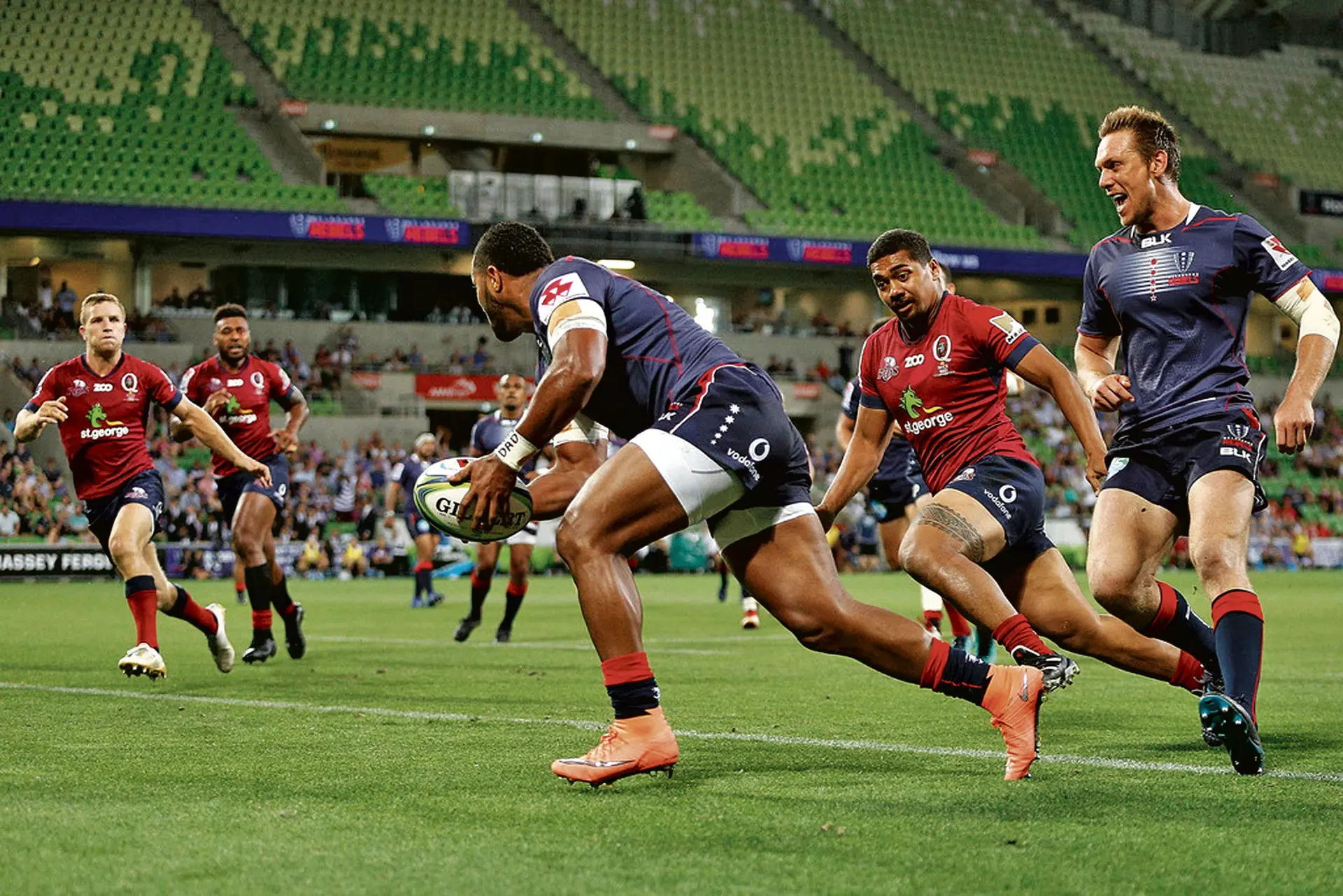 Melbourne Rebels winger Sefa Naivalu runs in to score his first try afainst Queensland Reds in the Super Rugby operner at the AAMI Park in Melbourne, Australia, on February 23, 2018. Photo: Zimbio