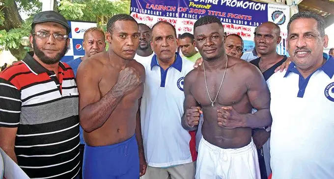 Savenaca Naliva and Joseph Kwadjo during the weigh-in at the Nair Dias in Nadi yesterday. Photo: WAISEA NASOKIA