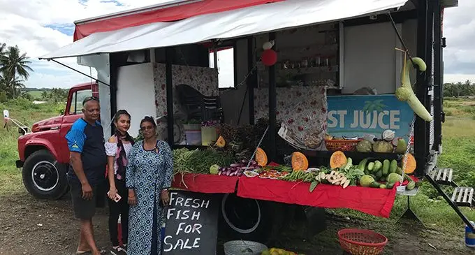 Kamleshwar Sharma with his wife, Rina Kumari, and daughter, Shimran Sharma, in front of their business set-up near Tuatua Housing in Labasa on June 1, 2020.  Photo: Shratika Naidu
