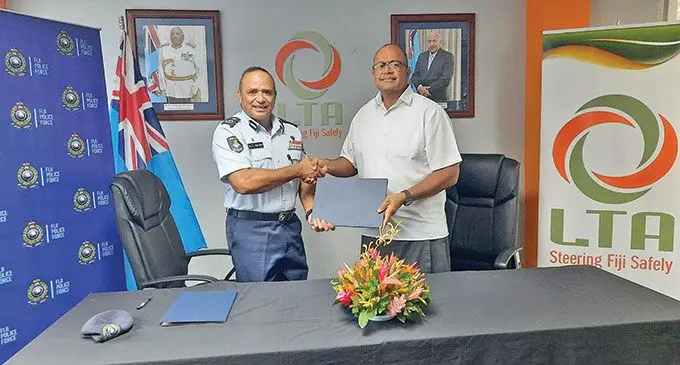 Police Commissioner Brigadier-General Sitiveni Qiliho (left), with Land Transport Authority (LTA) board chairperson, James Sowane after the signing of the Memorandum of Understanding between LTA and the Fiji Police Force.  Photo: Fiji Police Force