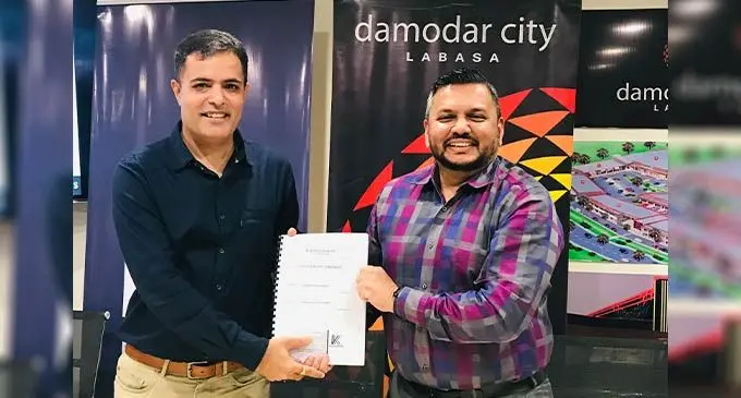 From left: S. Nagindas general manager Amit Khatri with Damodar Group Chief Executive Officer Div Damodar after the sales and purchase agreement handover on July 20, 2022. Photo: Laisa Lui