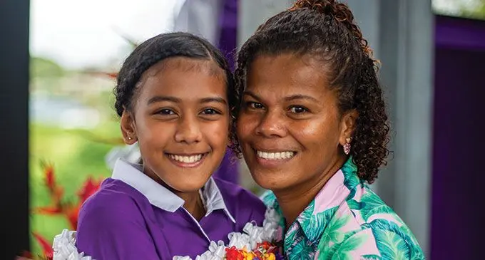 Dudley Intermediate School senior prefect Jane Naua alongside her mother Lusia Holmes  after their school prefect induction in Toorak on May 20, 2022.  Photo: Leon Lord