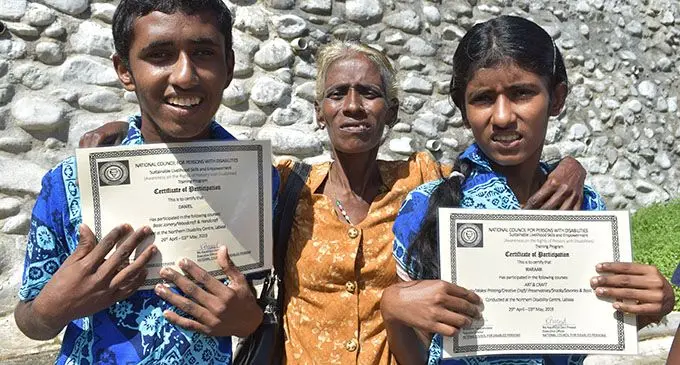 Premila Wati (middle) with her two children Maraam Lingam and Daniel Lingam after the graduation at the National Council For Persons With Disabilities  in Labasa on May 3,2019.  Photo: Shratika Naidu