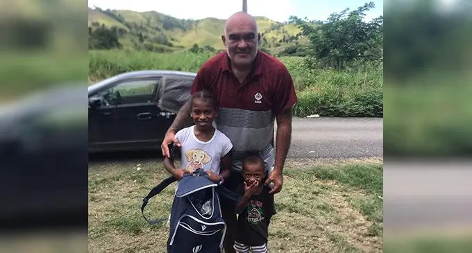 Flying Fijians head coach Simon Raiwalui with Vika and Inia Niunitoga. Photo: Supplied