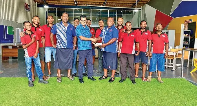 Al Hamd Smart Living Managing Director Ashfaaq Khan(fifth from left) hands over the cheque to Nadi Rugby Union’s president, Mataiasi Nabou, on October 21, 2020. 