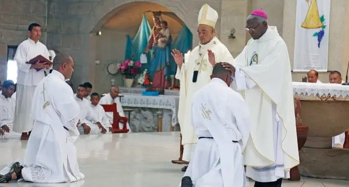 Archbishop Peter Loy Chong and Archbishop Novatus Rugambwa bless Rev Deacon Gabiriele Dulunaqio and  Rev Deacon Marisiale Weleca at the ordination to priesthood  service at the Sacred Heart Cathedral on November 16, 2019.  Photo: Kelera Sovasiga