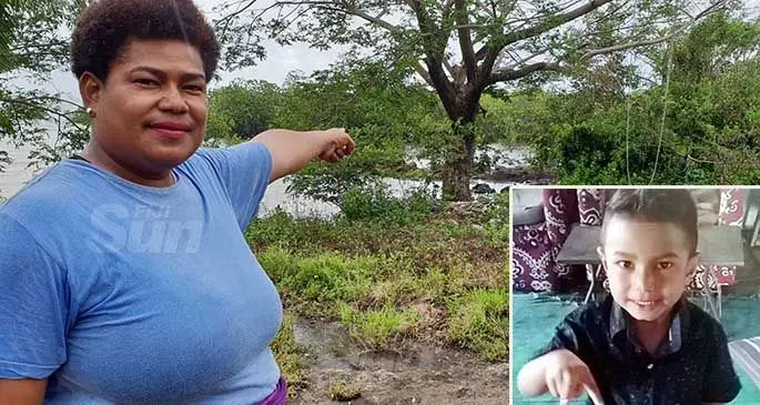 Avisaki Nabaro pointing to the mangroves where the body of a partially-decomposed child was found. INSET: Missing 3-year-old Karl Ratu.