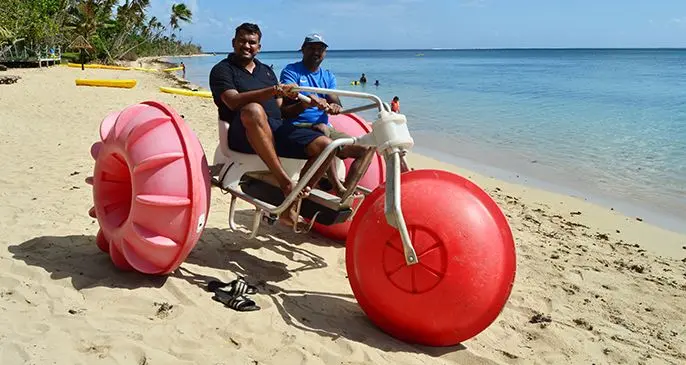 Local guests trying the water trike, an activity offered at Likuri Island Resort.