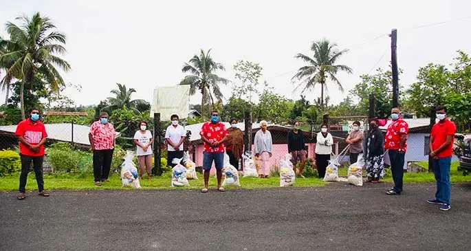 Residents of Korovou, Newtown receive food packages.