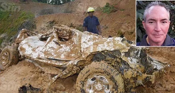 The late Seci Roko and the late Aporosa Ratu, were standing next to this wrecked 4WD when they were caught in a landslide at the quarry site at Mau Village, Namosi. Photo: Ronald Kumar Inset: David Johnson 