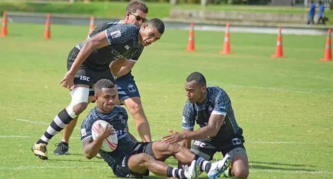 Fiji Sevens squad members Meli Derenalagi,Teri Tamani and Alosio Naduva train as Head Coach Gareth Baber looks on at Albert Park on March 20, 2019. Photo: Ronald Kumar.