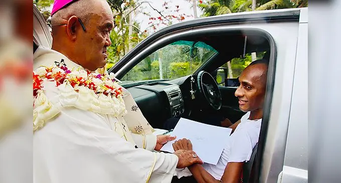 Keleto Lawakeli (right) received his Diploma in Theology from Archbishop Peter Loy Chong at the Pacific Regional Seminary in Suva on November 17, 2021. Photo - Archdiocese of Suva