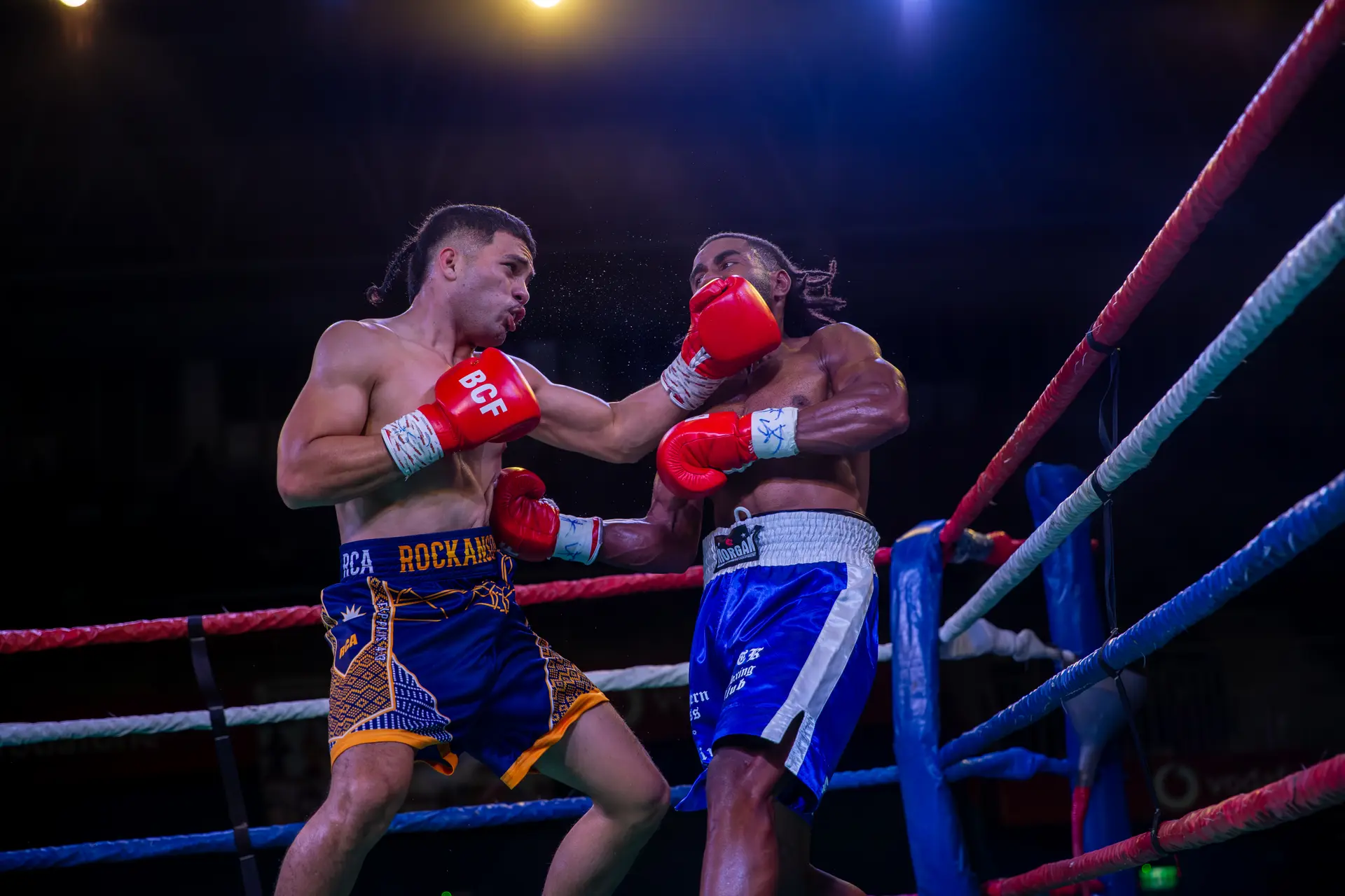 Rockanson (left) exchange blows with Masitoqi Rokoua in their light welterweight contest at the Vodafone Arena in Suva on July 25, 2026.