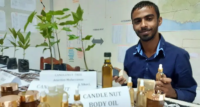 Young Averyl Avchial displays his products that may earn him a fortune soon. Photo: Ministry of Forestry.