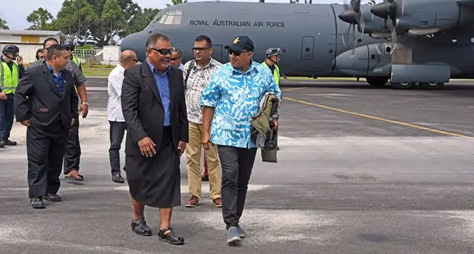 Prime Minister Voreqe Bainimarama (right), flew into Tuvalu on board a Royal Australian Air Force aircraft. He is being received by Tuvalu’s Foreign Minister Taukelina Finikaso on August 11, 2019. Photo: DEPTFO News