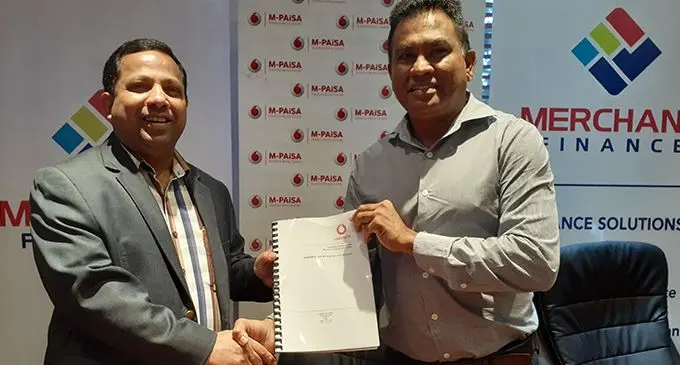 From left:Fijian Holdings Limited group chief executive officer and Deputy Chairman of Merchant Finance Limited Nouzab Fareed and Vodafone’s head of e-commerce and corporate affairs Shailendra Prasad. Photo: LAISEANA NASIGA