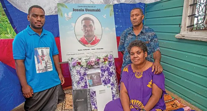Family of the late Josaia Usumaki (pictured) (from left) Leone Tawake (brother) Nieta Salakula (sitting) and Josaia Usumaki (father) commemorating the life and graduation of the late  Josaia Usumaki from the University of the South Pacific at their home in Nasole on May 15, 2022. Photo: Leon Lord