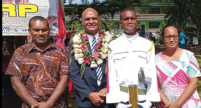 Saint Thomas High School head boy Lasaro Driubalavu is flanked by his parents {first from left) Misaele Driubalavu and Kirisitiana Volivoli {far right), with the Commissioner West Apolosi Lewaqai (second from left) after the school's passing-out parade on July 26, 2024. Photo: Charles Chambers