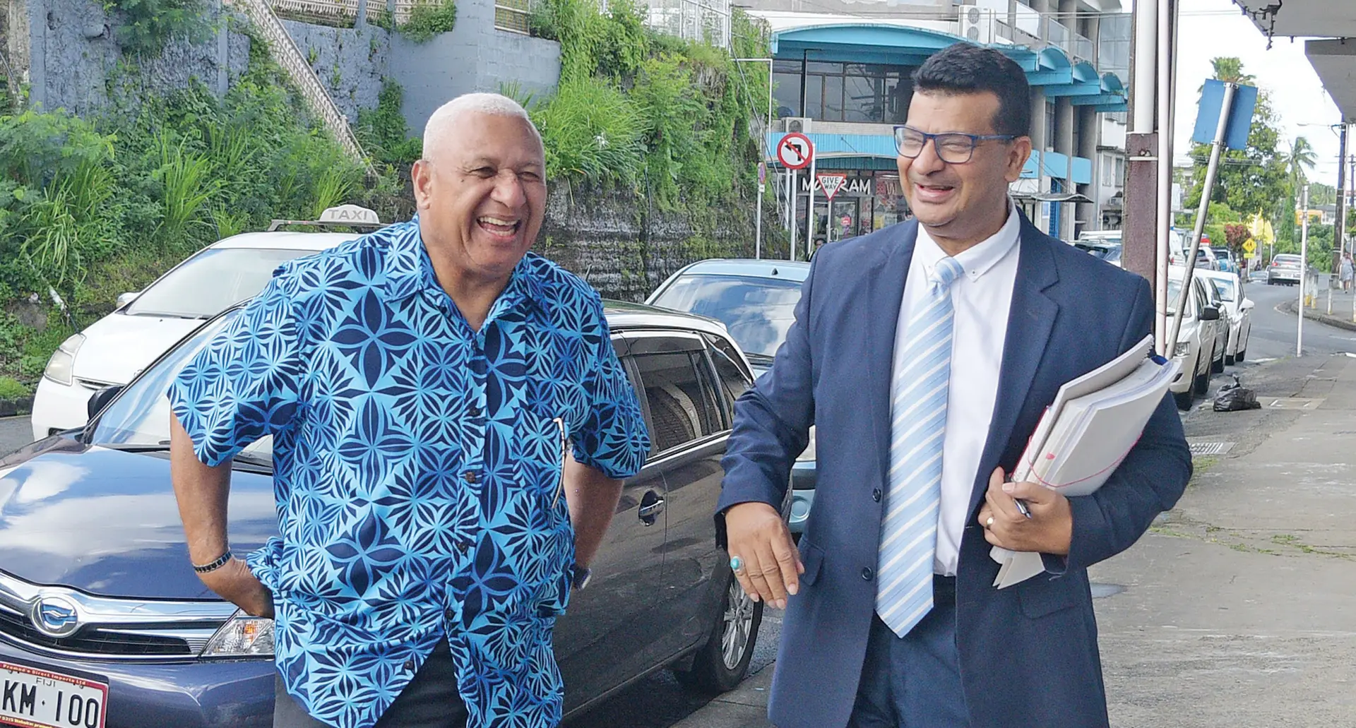 Former Prime Minister Voreqe Bainimarama and lawyer, Devanesh Sharma, outside CID headquarters in Suva on May 12, 2023. Photo: Ronald Kumar