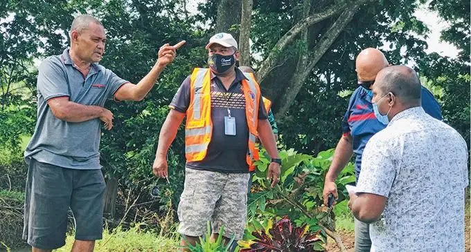Vunivau resident Jese Midralawa (left) with Minister for Rural and Maritime Development and Disaster Management Inia Seruiratu and Commissioner Northern Uraia Rainima at Vunivau in Labasa on January 15, 2022. Photo: Laisa Lui
