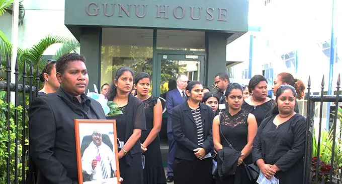 Staff members from the office of the Director of Public Prosecutions  paying their last respects to the late Mosese Korovou’s outside the ODPP’s office in Suva, on July 5, 2019.  Photo: Simione Haravanua