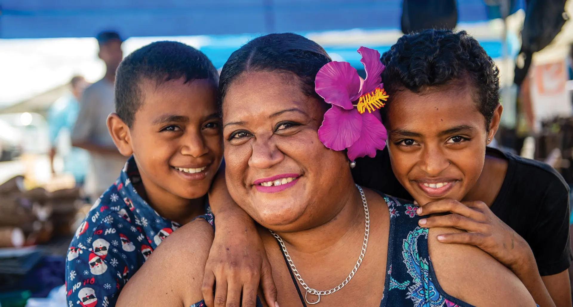 From left: 10 year old Mosese Cevarua, Asinate Mekevakatoga (mom) and 11 year old Kesaia Maca. Photo: Leon Lord