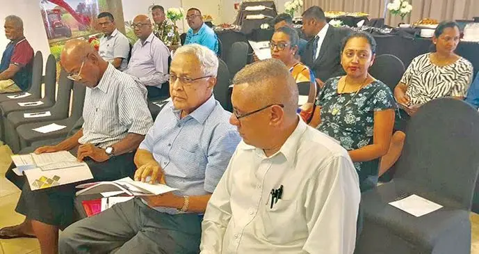 Attendees Former Prime Minister Mahendra Chaudhry (second from right) and Ben Padarath during the Fiji Sugar Corporation annual general meeting at Tanoa Waterfront Hotel on October 1, 2019.