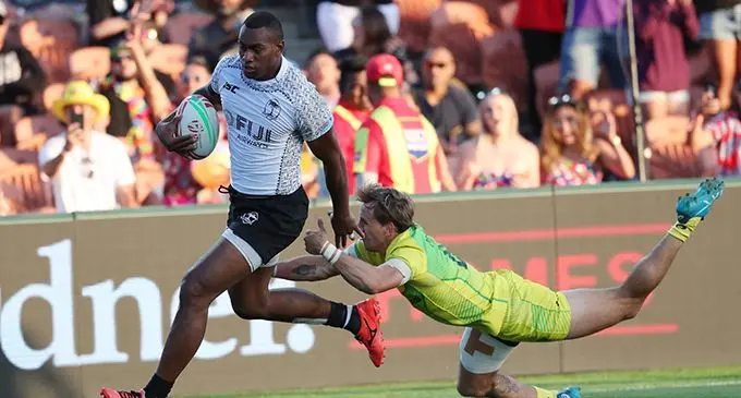 Fiji's Mesulame Kunavula runs away for a try during the World Rugby Sevens Series match between Fiji and Australia at Waikato Stadium in Hamilton on January 26, 2019. (Photo by MICHAEL BRADLEY / AFP)