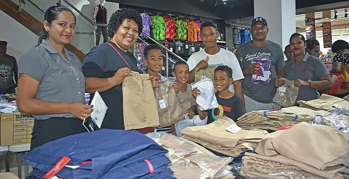 Kini Boka (second from right) with his family members and two other Meenoos Store staff in Nadi. Photo: Mereleki Nai