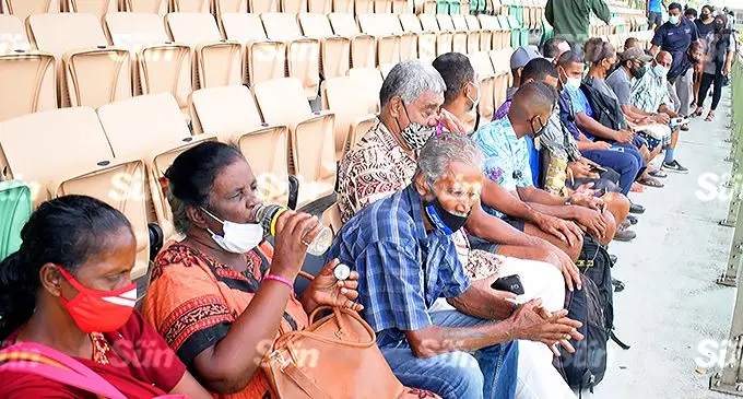 People waiting for booster vaccination shots at Albert Park vaccination centre on December 30, 2021. Photo: Ronald Kumar