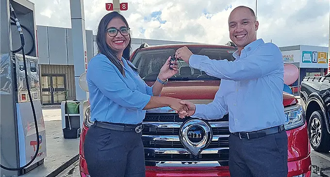 From left: Winner Payal Prastika receives the keys to her brand new GWM Cannon-L Ute 4X4 van from the TotalEnergies Fiji Managing Director Dennis Michael Cuaycong at the TotalEnergies Service station in Nokonoko, Laucala Beach on April 25, 2024. Photo: Romeka Kumari