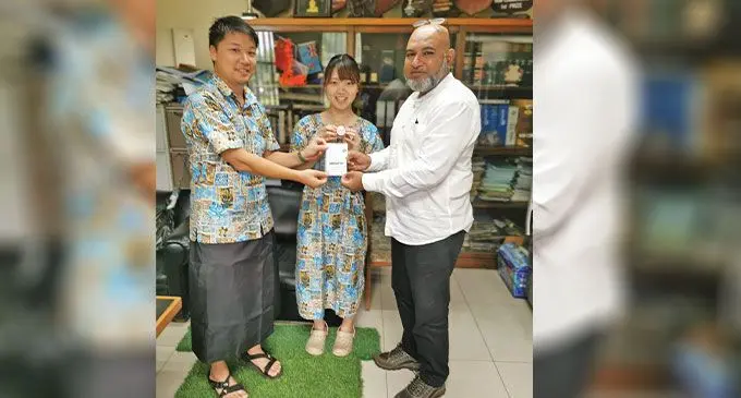 From left: Social Innovation Fiji Founder Akifumi Kawakami, Social Innovation Fiji member Kaeoko Suenaga and Lautoka City Council Chief Executive officer Mohammed Anees Khan hold up a Arigato Earth project stamp card on February 21,2023. Photo: Social Innovation Fiji