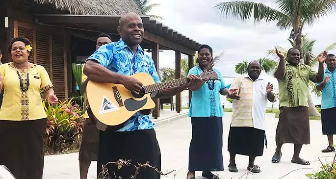 Staff members greet the first locals to arrive at the re-opened Plantation Island Resort on June 26, 2020. Photo: Charles Chambers