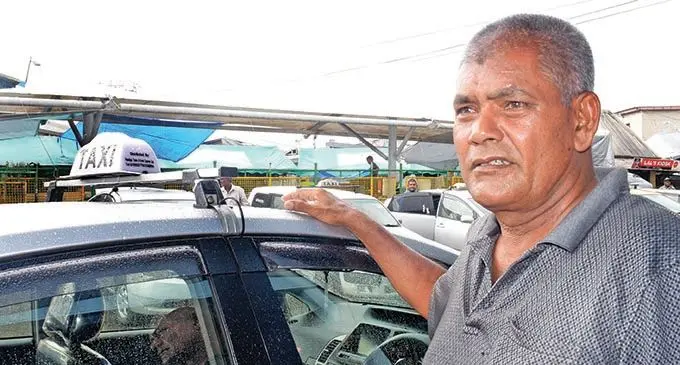 Taxi owner Kamlesh Prasad is still in shock with news of his drivers death.  Photo: Ronald Kumar