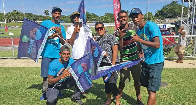 Solomoni Muaduaduakibau (kneeling) with family members in Moana Pasifika colours at Churchill Park, Lautoka, on May 27, 2023. Swire Shipping Fijian Drua won 47-46. Photo: Ioane Asioli