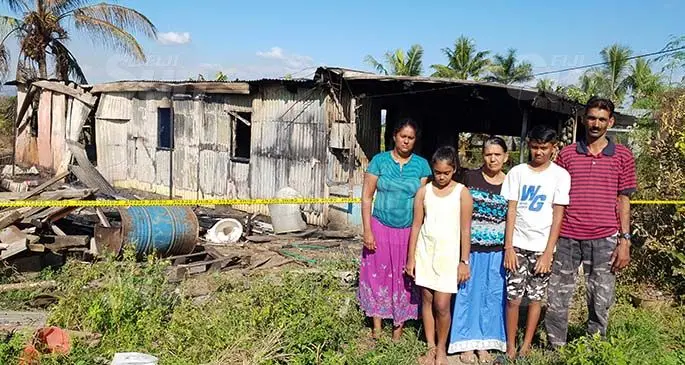 Kavita Devi, Ashmita Devi, Shushila, Aniket Chand and Amrit Chand in front of their home, which was destroyed in a fire on August 9, 2020. Photo: Nicolette Chambers