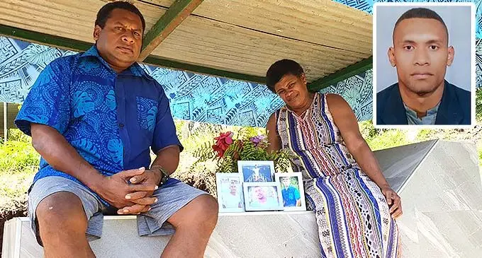 Still in the dark over tragic death of son... Parents Ulaiasi and Mere Nasilasila at the grave site of their son Mosese Nasilasila, outside their family home in Tomuka, Lautoka, on November 18, 2021. INSET: The late Mosese Nasilasila. Photo: Nicolette Chambers