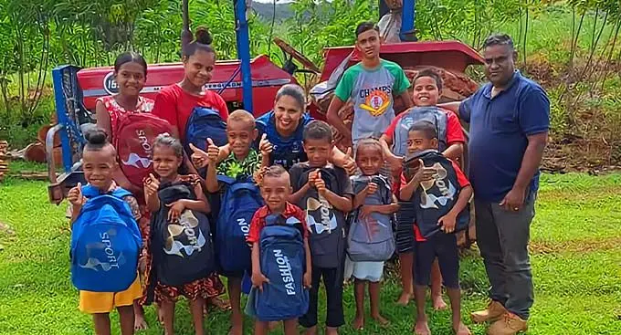 Far right: Victory Christian Fellowship Church pastor, Samuel Jeet, Foundation for the Education of the Needy Children in Fiji (FENC Fiji) national co-ordinator, (third from left-back row) Priya Lata, assisted poor primary school students at Raranikawai, outside Labasa on December 27, 2022.