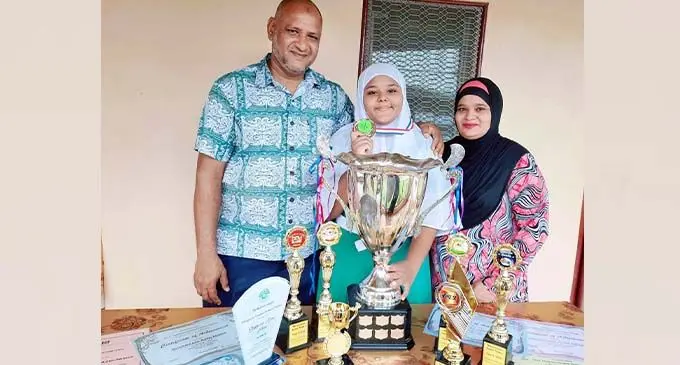 Proud parents, Mohammed Shameem and Nisha Shameem with their daughter Sheeraani Azmi Nisha at their Nadi home on December 22, 2020.