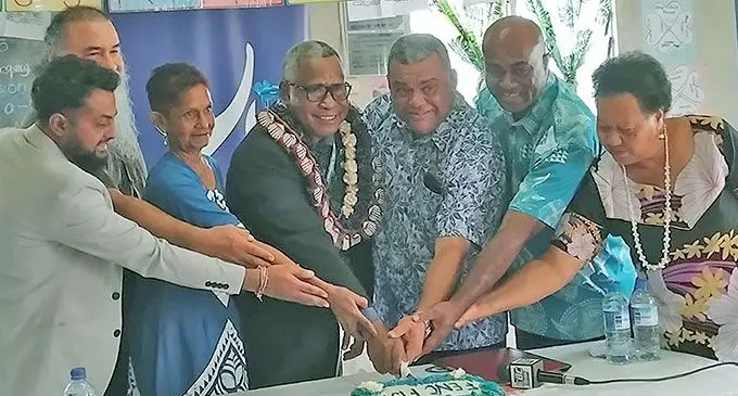 Assistant Minister for Education Iliesa Vanawalu (with garland) and stakeholders cut the celebratory cake during the learning centre opening ceremony at Tovata, Makoi on October 8, 2024.