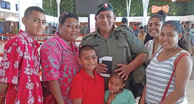 Private Muqueem Begg (back third from left), with wife, Sera Begg and their five children at the Nadi International Airport on March 18, 2019. Photo: Josie Cakausese