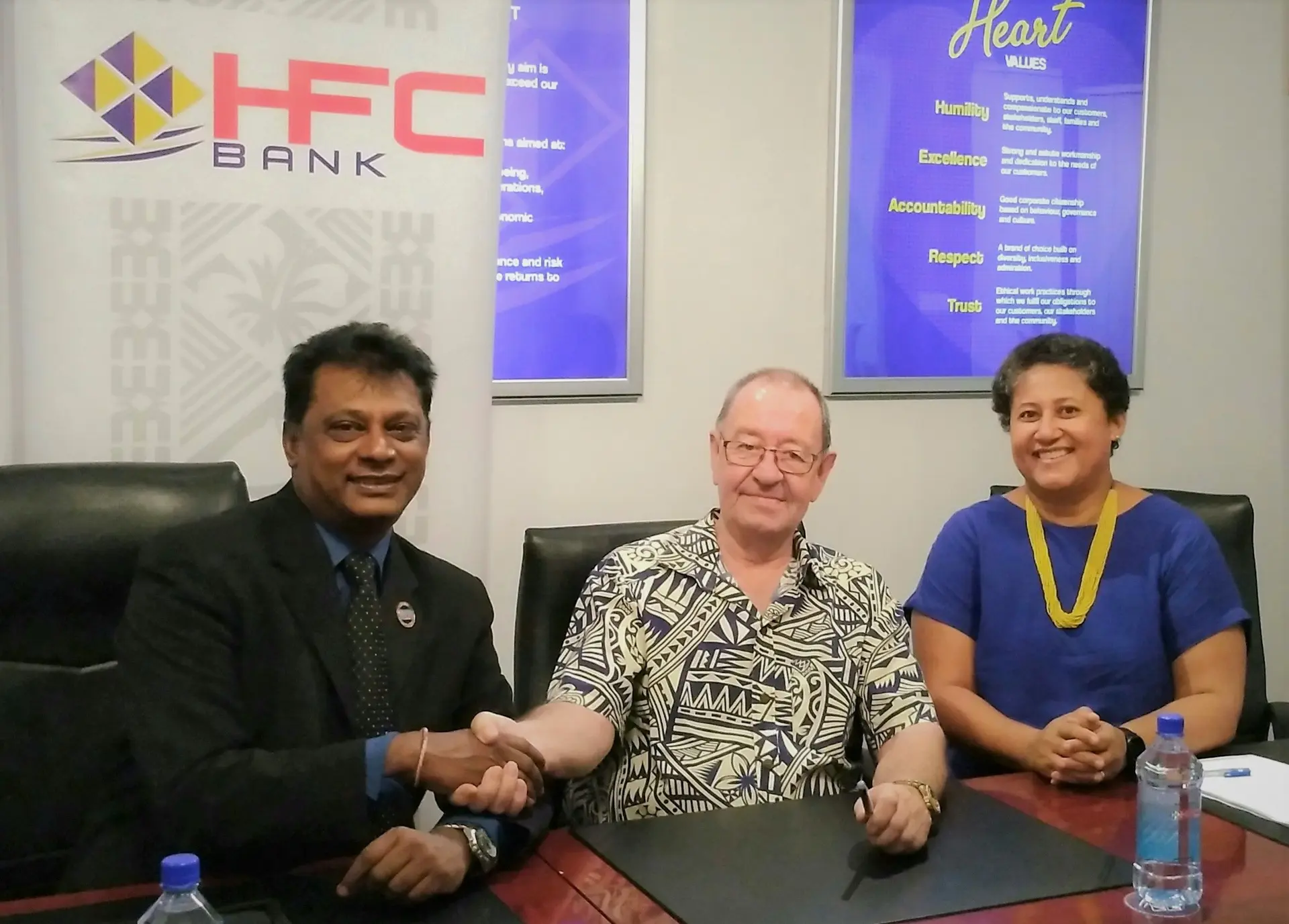 HFC Bank CEO, Rakesh Ram, seals the naming right sponsorship of the iconic National Stadium with the Fiji Sports Council Board Chairman, Peter Mazey, and Fiji Sport Council CEO, Litiana Loabuka. 