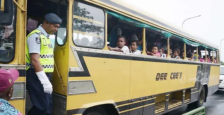 Police Constable Timoci Dakuna was spotted on April 17, 2023, ensuring the safety of students boarding a bus outside the HFC Bank Stadium in Suva. Photo: Ronald Kumar
