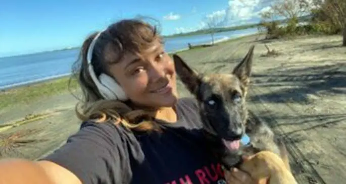 Fiji Airways Fijiana XV prop Lailanie Burnes with her dog on the beach in Nadi.