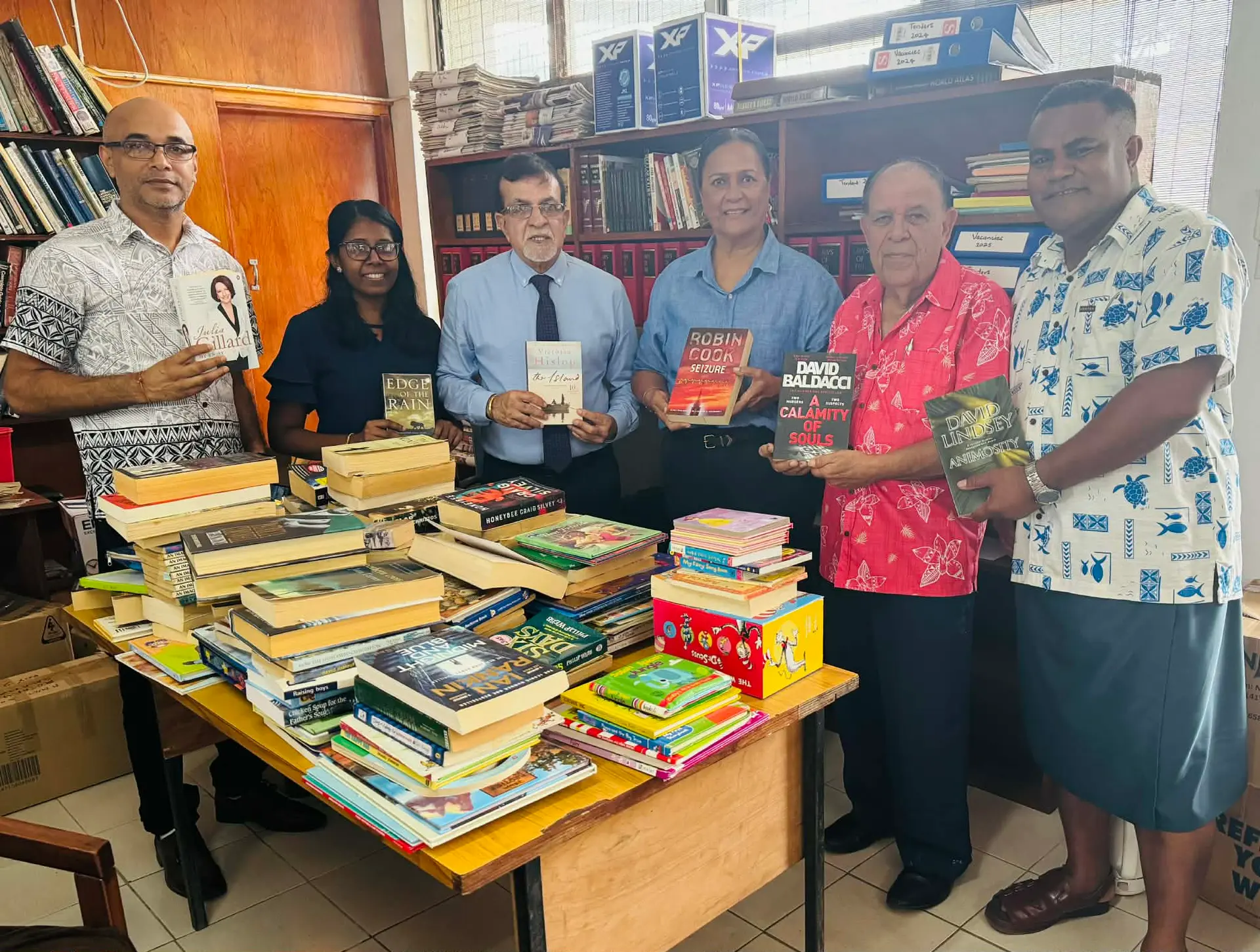 Labasa Town Council special administrator Samuela Ligairi (right), special administrator chairperson Paul Jaduram received books from Rotary Club of Labasa president Amelia Simmons (third from the right) and the members at Labasa Town Council library on April 27, 2026. 
