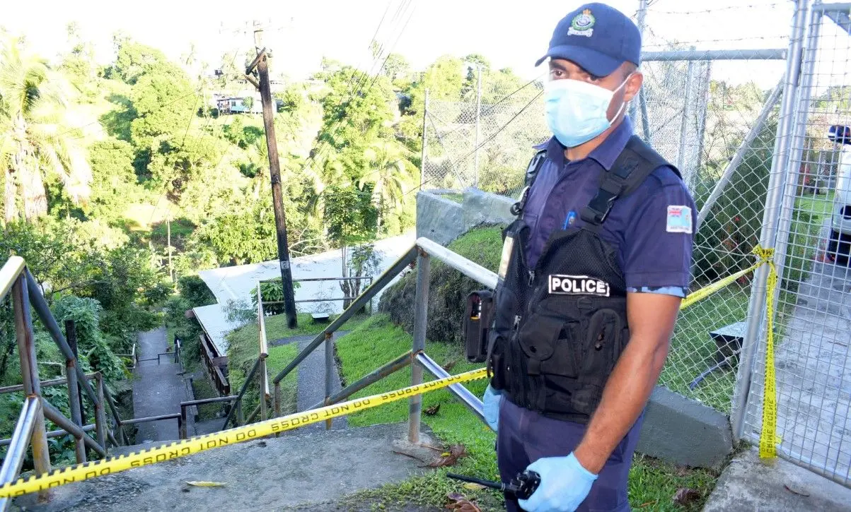 Police officers set up the containment zone at Wainitarawau settlement, Cunningham, Suva. Photo: Ronald Kumar