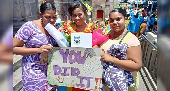 Graduate Vitalina Burese flanked by best friends Kesaia Taylor (left), and Mary Joan. Photo: Josefa Babitu