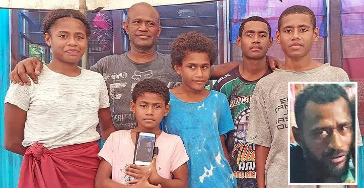 Jovesa Nausa, with the late Maika Moko’s children (from left): Alowesi Gavidi, Loraina Gavidi ,Fulori Gavidi,Isimeli Gavidi and Meli Vuilabasa hold up a photo of their late father at their home in Luvuci, Natalecake village, Ba on March 14, 2023. Photo: Salote Qalubau
